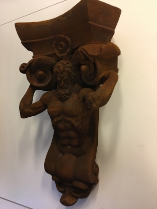 Very striking wall bracket -ornament with garing man, Polystone rest.